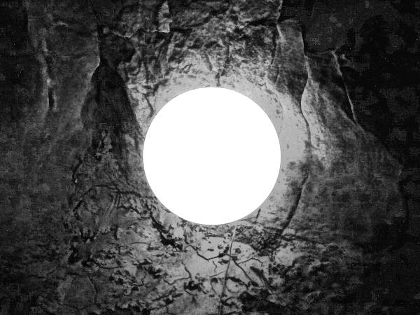 a round lamp illuminating a cave