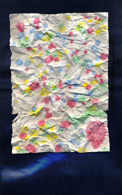 color dots on crumpled paper