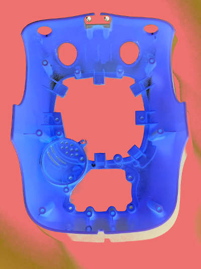 A yellow plastic kids play phone case photographed from the inside, but the colors are inverted, so it’s blue now. The holes of the plastic thing looks a bit like a screaming face