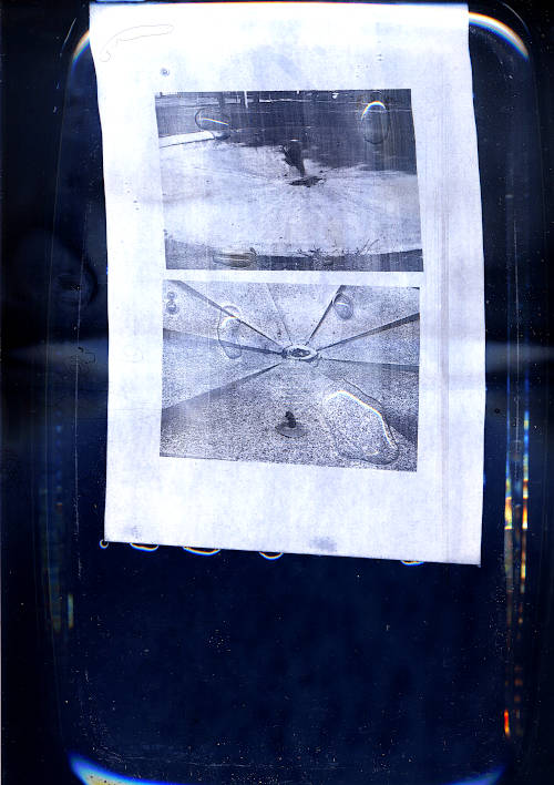 scan image. laser printed copy with two pictures of dry public fountains. water drops visible on the print