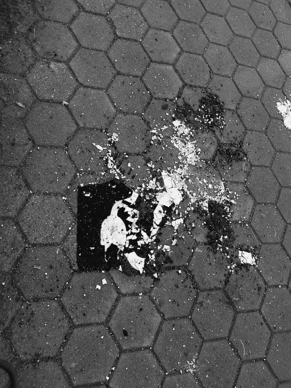 crushed street painted sign for emobility parking, black and white digital photography