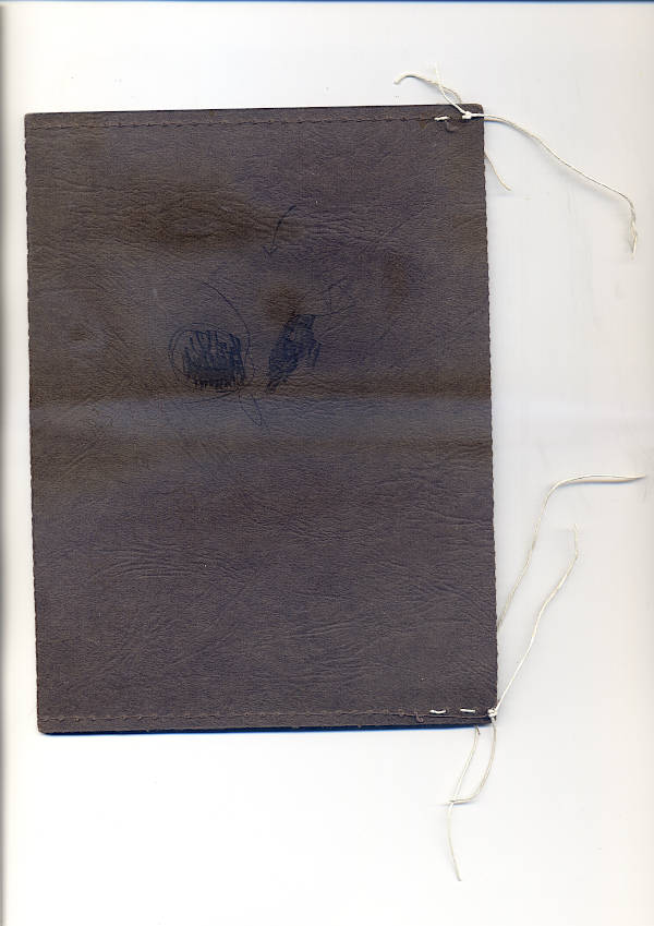 cover of a closed passe partout book. Brown textured envelope paper with charcoal traces.