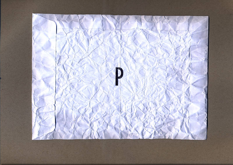 A crumpled white envelope with the letter P stamped on it