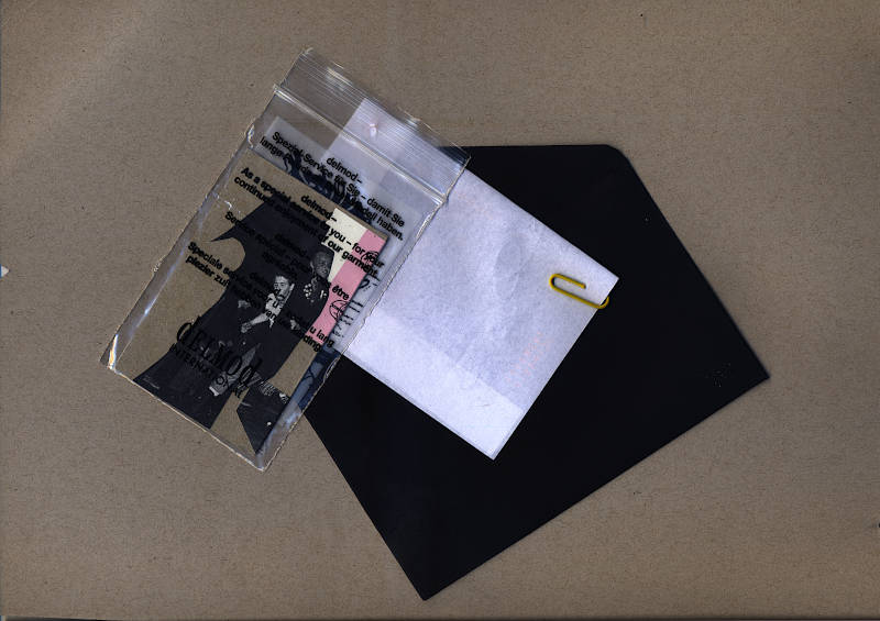 inside the black envelope there is a small plastic zip bag with a collage card and a folded note